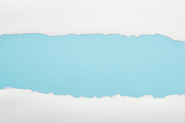 istock ragged white and textured paper with copy space on light blue background 1149835814