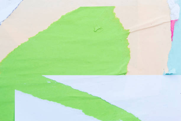 istock Colorful sheets of torn paper pasted on the wall. 1149836482