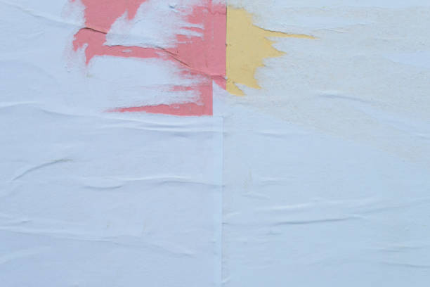 istock Colorful sheets of torn paper pasted on the wall. 1149836903