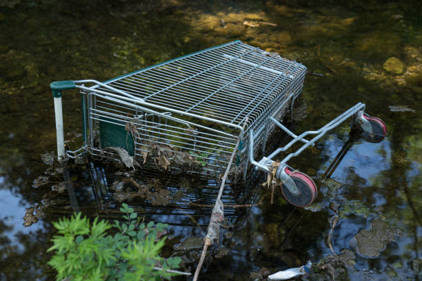istock Metalic Shopping cart floating on water 1149837258