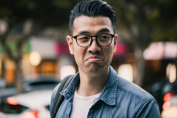 istock Young handsome man making funny face at roadside 1149837267