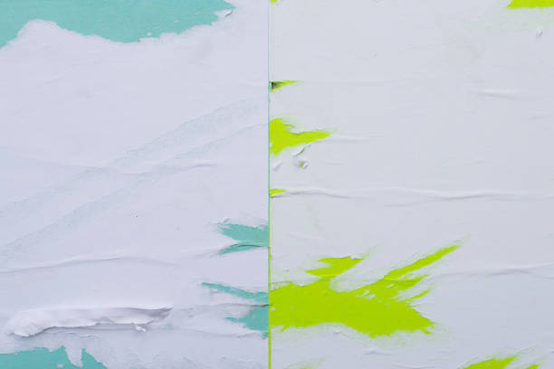 istock Colorful sheets of torn paper pasted on the wall. 1149837564