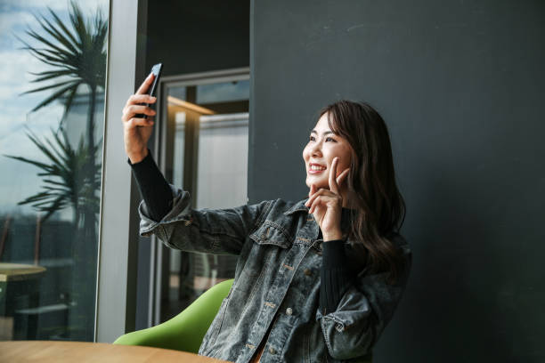 istock Young women playing mobile game and selfie 1149838962