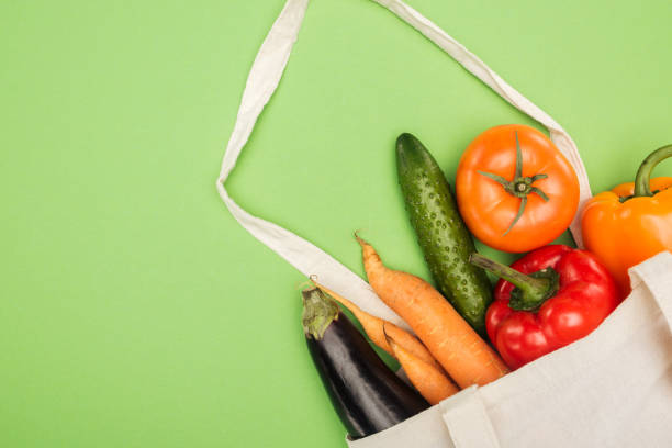 istock cotton bag with fresh ripe vegetables on light green background 1149839748