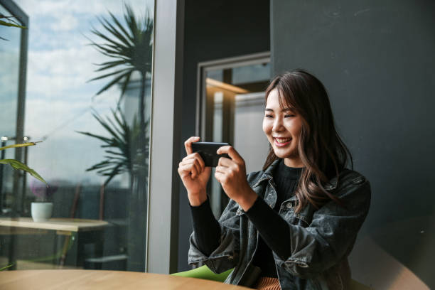 istock Young women playing mobile game and selfie 1149839865