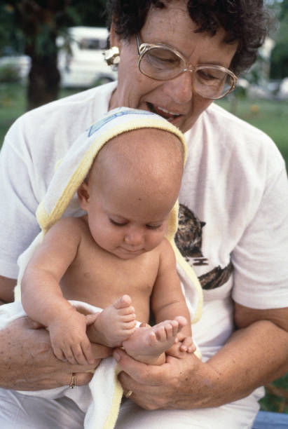 istock Infant sitting on grandmother's lap 1149841339