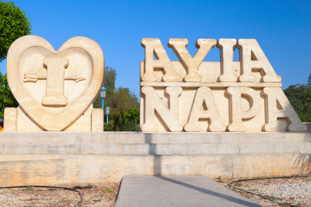 Ayia Napa, Cyprus - June 11, 2018: Town name sculpture monument in Ayia Napa resort town at the far eastern end of the southern coast of Cyprus island