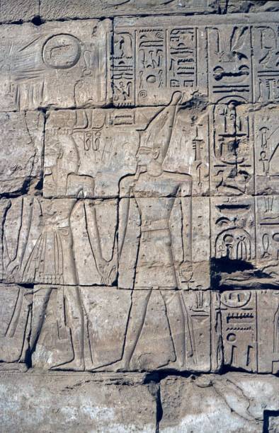 istock Wall relief with pharaoh and deity at a temple wall in Edfu, Egypt 1149845320