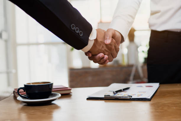 istock business cooperation and confident partner concept, business people shake hands with customer or partner 1149846556