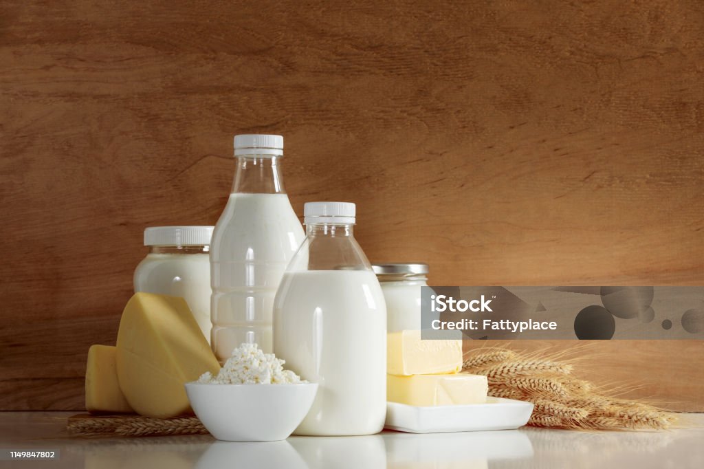 Dairy products concept Natural organic dairy products such as milk, butter, yogurt, cheese, cottage cheese, cream and kefir, front view composition Milk Stock Photo