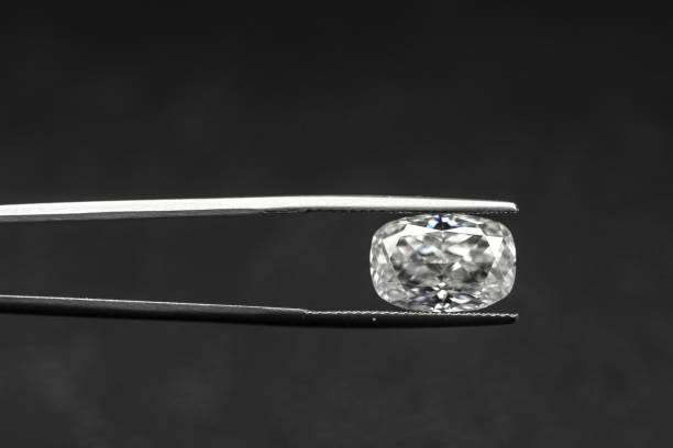 istock Diamond in Tweezers 1149850847