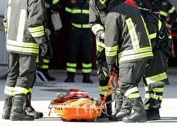 istock stretcher with the wounded and firefighters who saved the injure 1149859547