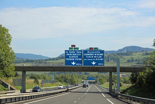 traffic sign on the highway in France with names of many french and italian city