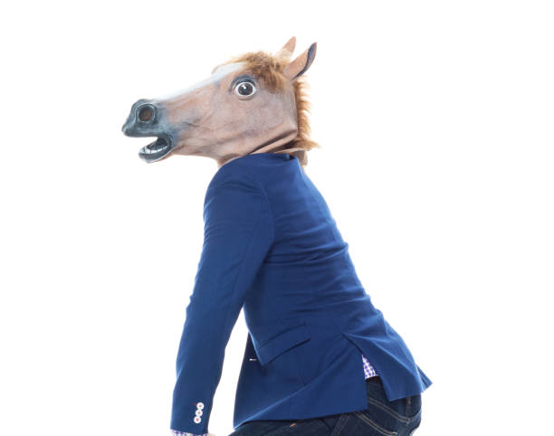 istock Businessman with horse mask is dancing 1149860177