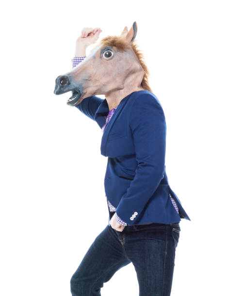 istock Businessman with horse mask is dancing 1149860461