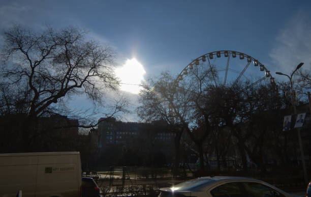 BUDAPEST, HUNGARY - DECEMBER 29, 2017: Walking near Ferris wheel in Budapest on December 29, 2017.