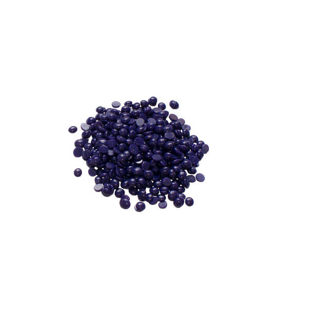 istock Depilatory hard wax beans isolated on white background. Pearly wax granules from lavender. 1149872321