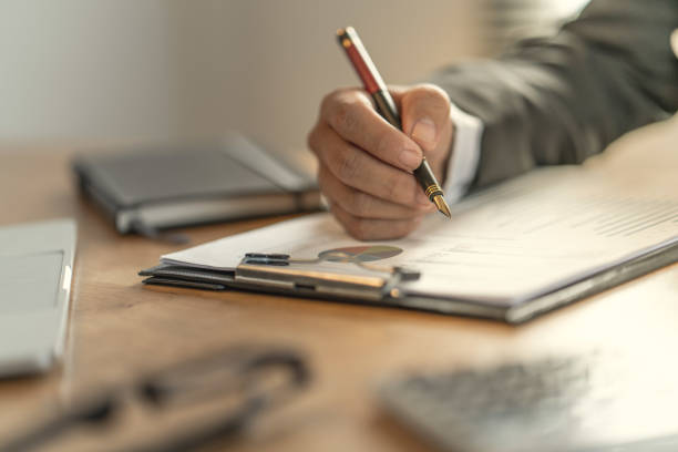 istock The accountant checking documents about graph and chart relating to financial reporting and tax accounting of the company 1149876338