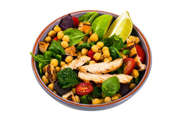 Grilled Chicken Salad Grilled Chicken Salad with Garbanzo Bean Isolated on white background. Selective focus. salad fruit lettuce spring stock pictures, royalty-free photos & images