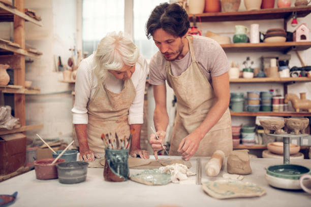istock Handsome young man showing how to paint 1149878980