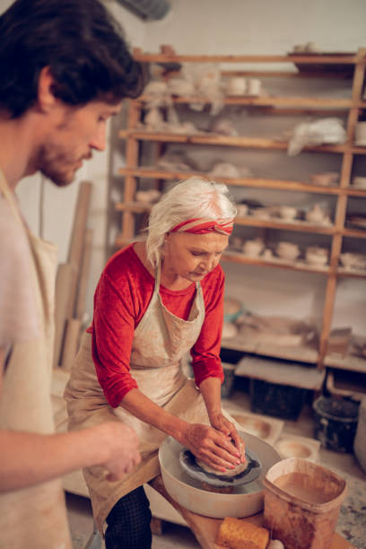 istock Good looking aged woman being involved in work 1149879035