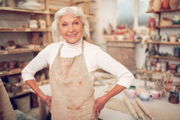 istock Joyful grey haired woman smiling to you 1149879078