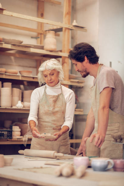 istock Pleasant senior woman looking at her work 1149879091