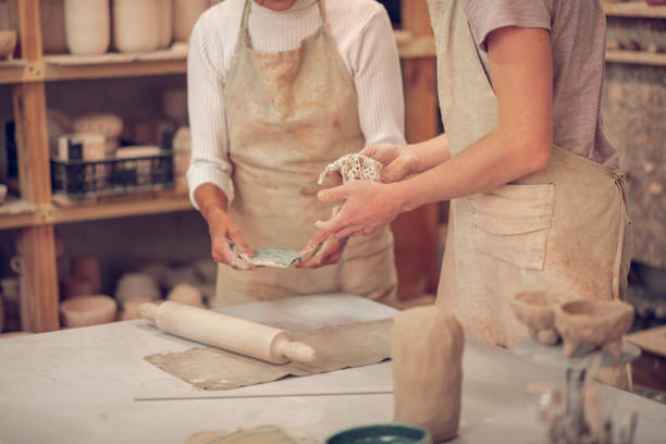 istock Close up of two people working in team 1149879093