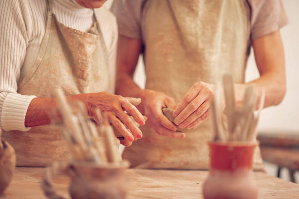 istock Hands of a teacher and her apprentice 1149879152