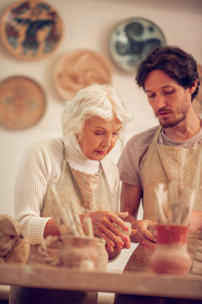 istock Pleasant senior woman working with her apprentice 1149879154
