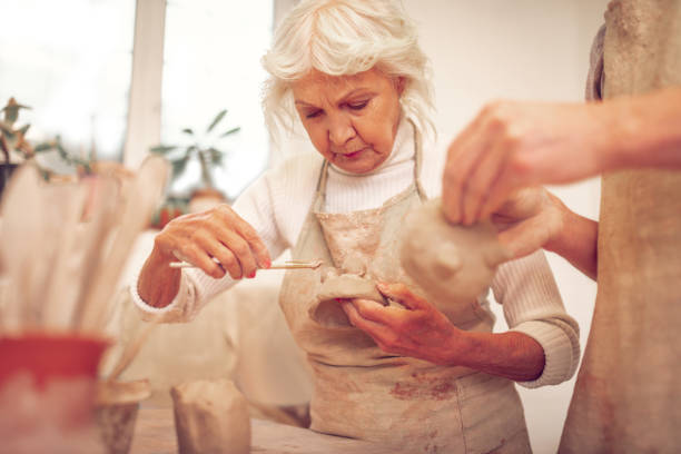 istock Serious aged woman looking at the bowl 1149879182