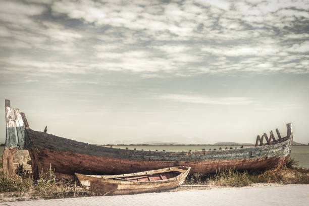 Abandoned old fishing boat on the shore at Lefkada Island, Greece