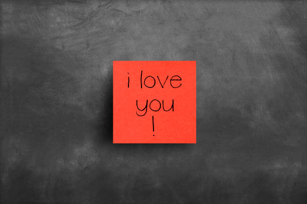 istock Sticky note on blackboard, i love you 1149882742