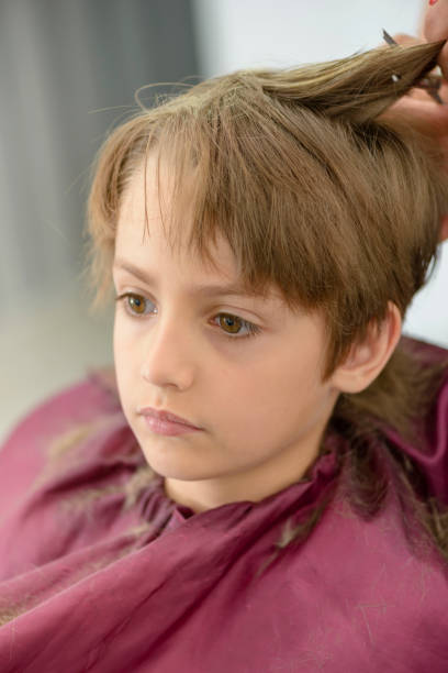 istock Kid at Barbershop 1149882753