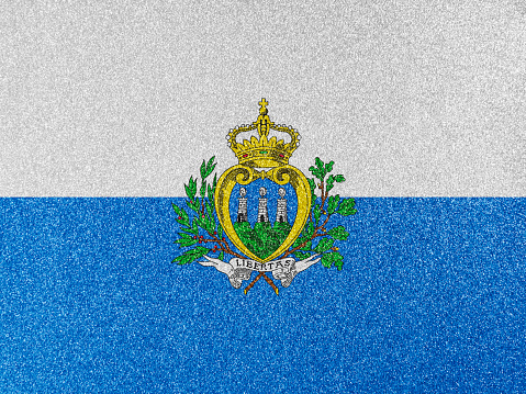 San Marino national flag on glitter texture.