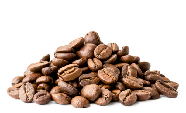 istock Heap of coffee beans closeup on a white. Isolated. 1149884372