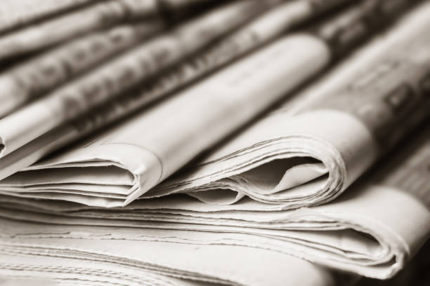 istock News concept, folded newspaper closeup. 1149889645