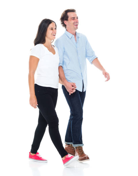 istock Happy couple walking and holding hands 1149893272