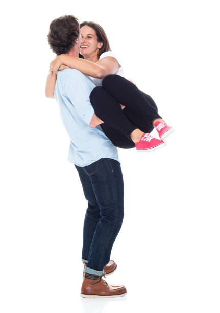 istock Happy husband carrying his wife 1149893321