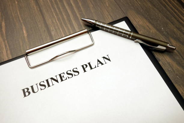 istock Clipboard with business plan and pen on desk 1149894926