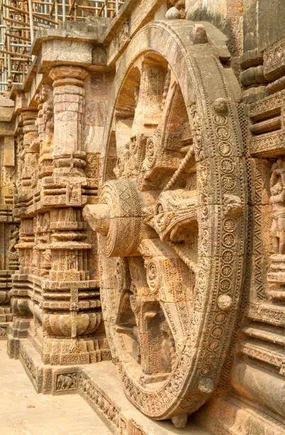 Close-up of chariot wheel intricate carvings in the ancient Hindu Sun Temple in Konark, Orissa, India. 13th-century CE. The temple is attributed to king Narasingha deva I of the Eastern Ganga Dynasty
