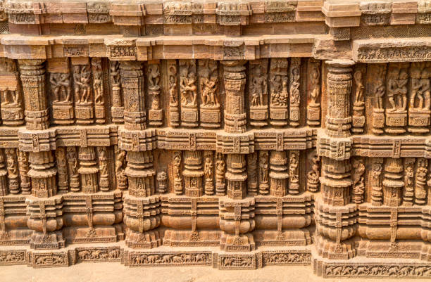 Intricate sculptures stone carving on the walls of the ancient Hindu Sun Temple in Konark, Orissa, India. 13th-century CE stock photo