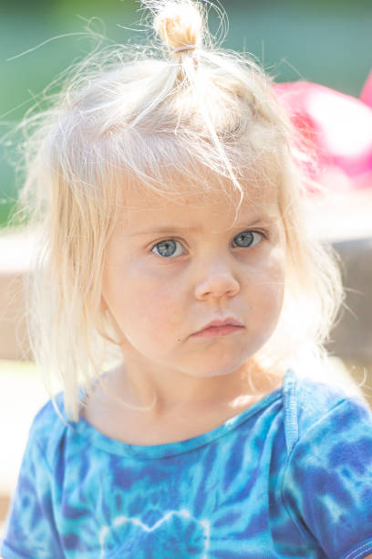 istock Caucasian child girl looking at the camera 1149896108