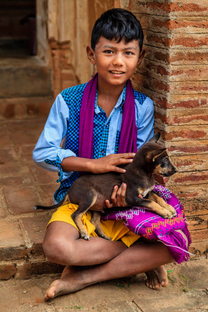 istock Young Burmese boy sitting in temple, Old Bagan, Myanmar 1149896492