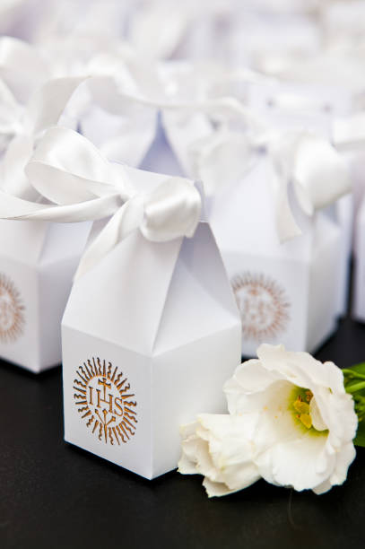istock First holy communion boxes with thank you notes for guests. 1149896703