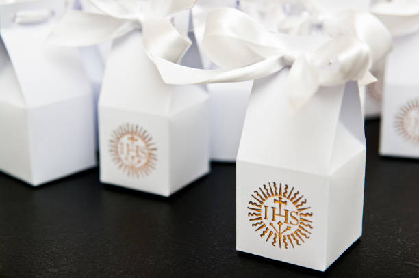 istock First holy communion boxes with thank you notes for guests. 1149896732