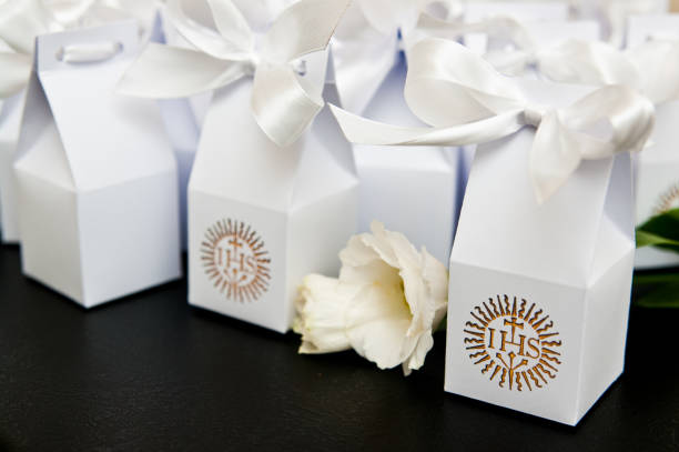 istock First holy communion boxes with thank you notes for guests. 1149896859