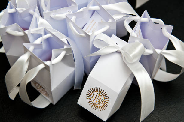 istock First holy communion boxes with thank you notes for guests. 1149896865