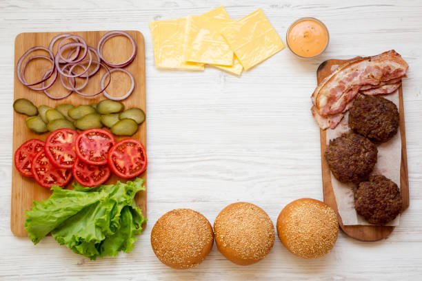istock Cheeseburger ingredients, overhead view. From above, top view, flat lay. Copy space. 1149897840