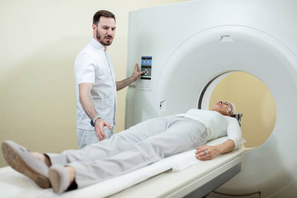 istock Radiologist preparing a patient for an MR scan examination at clinic. 1149897918